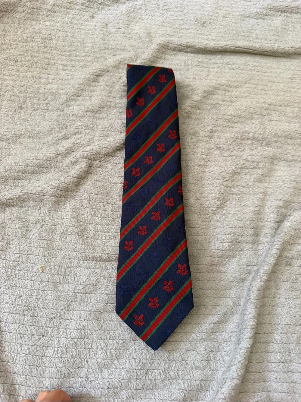 Navy Diagonal Stripe Tie with Red Crest Detail
